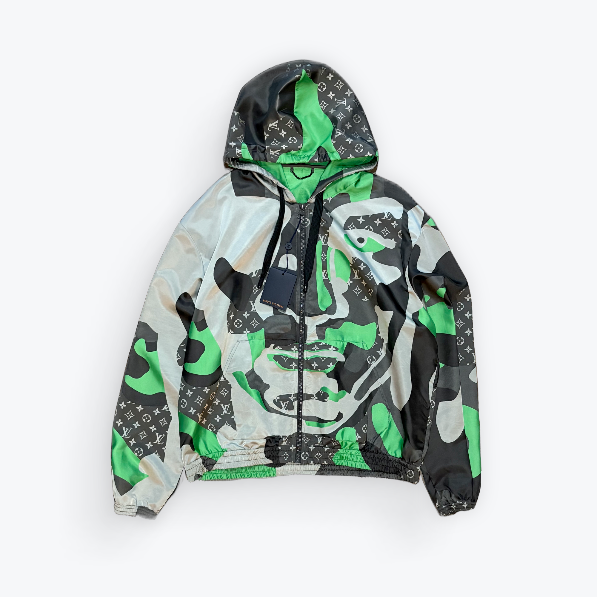 Camouflage-patterned jacket with green accents on a white background