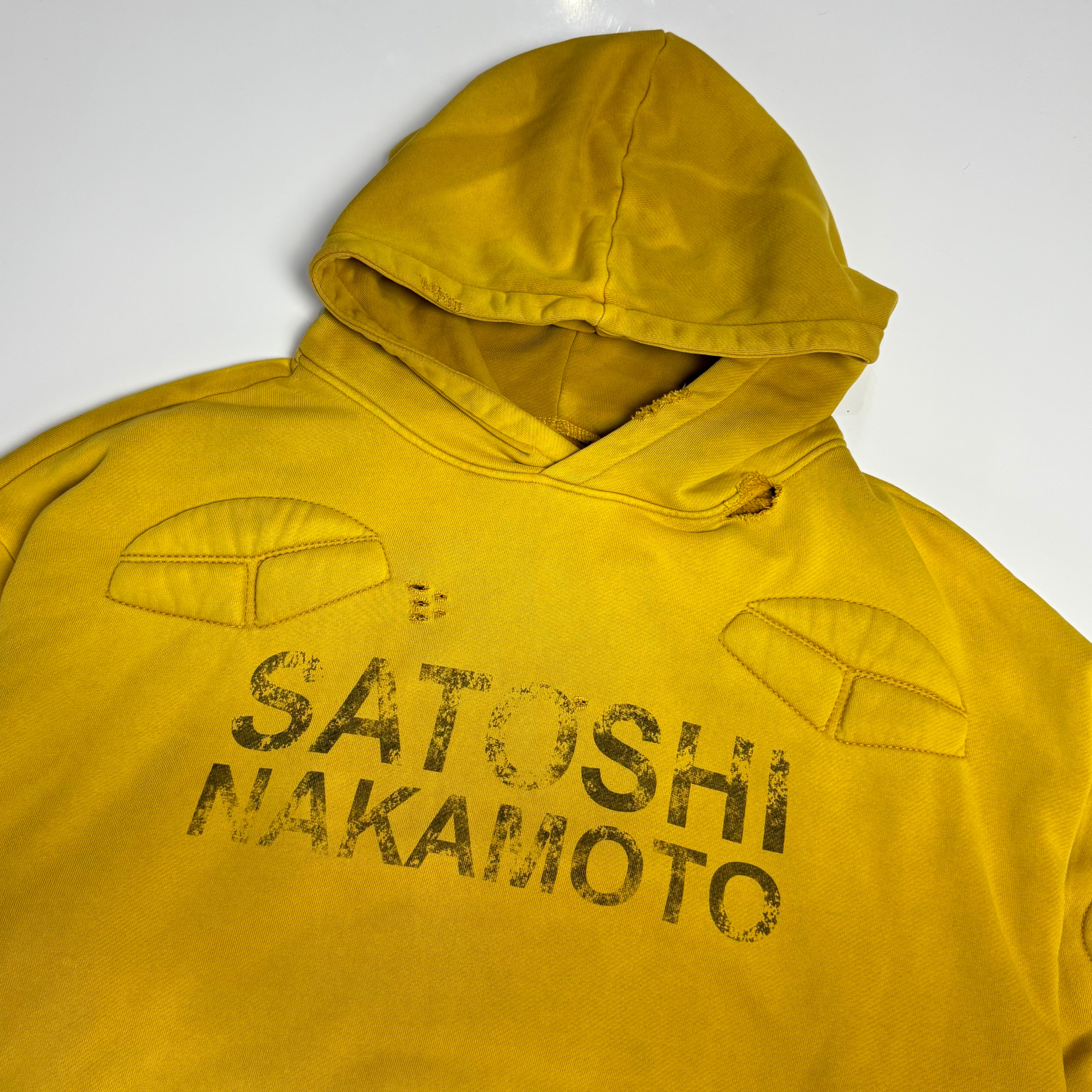 Yellow hoodie with 'Satoshi Nakamoto' text on a white background