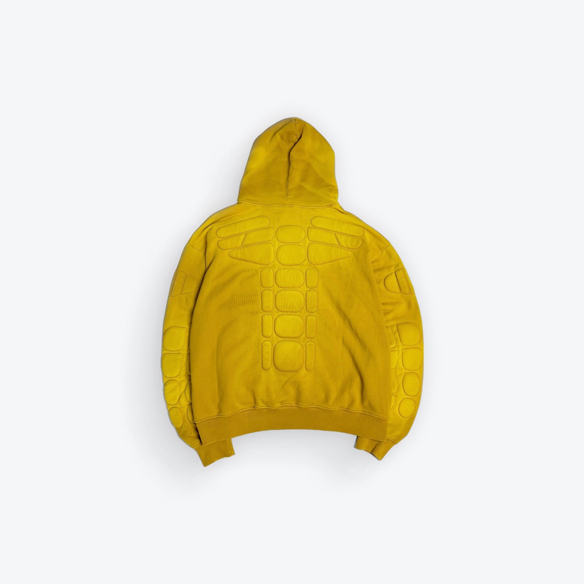 Yellow hoodie with turtle shell pattern on a white background